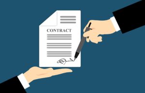 Ręka podpisująca kontrakt
